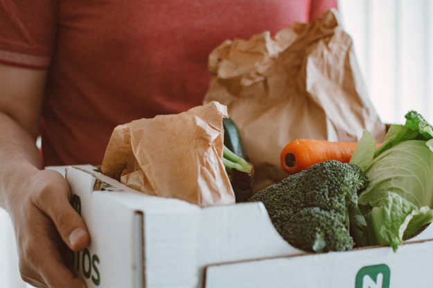 Someone holding a box of groceries